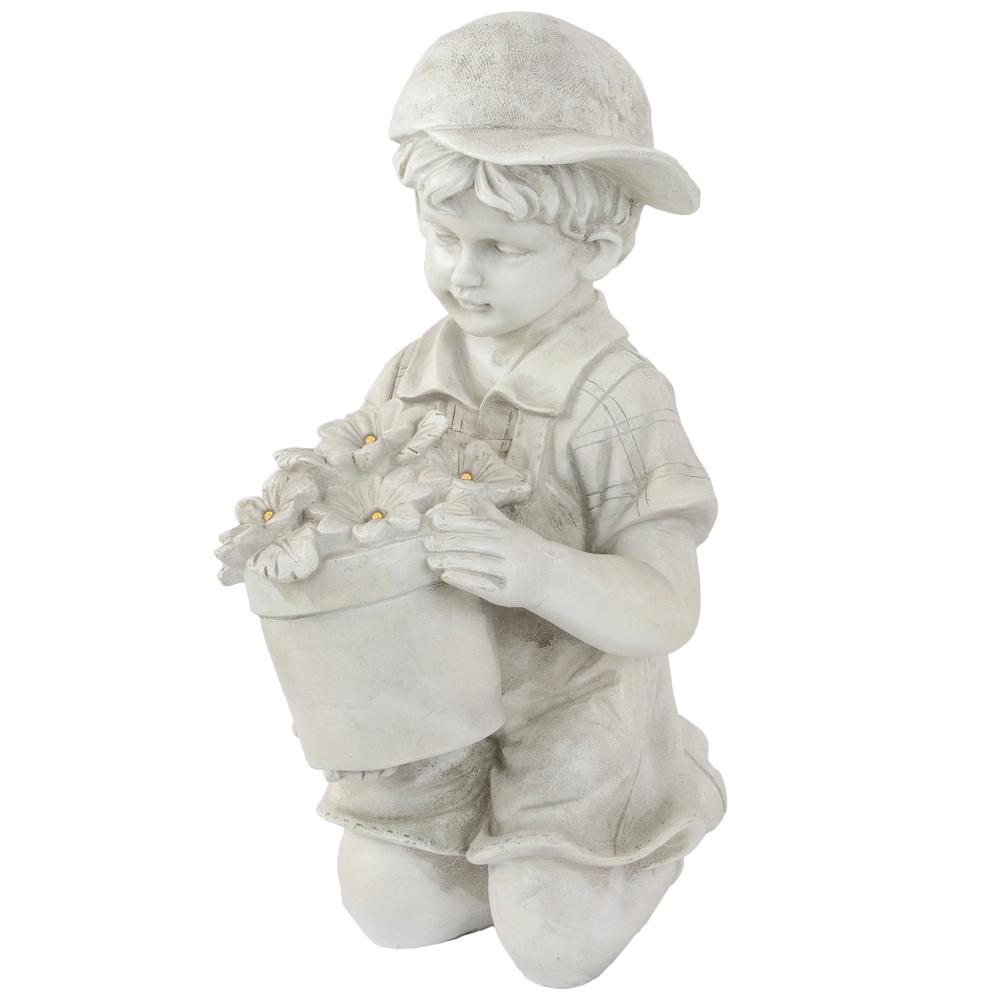 15" Solar LED Lighted Boy with Flowers Outdoor Garden Statue. Picture 1