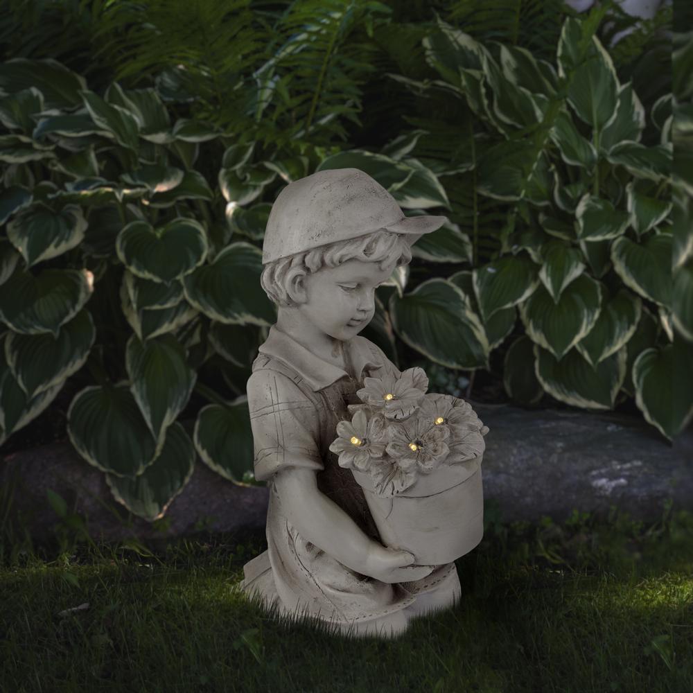 15" Solar LED Lighted Boy with Flowers Outdoor Garden Statue. Picture 2