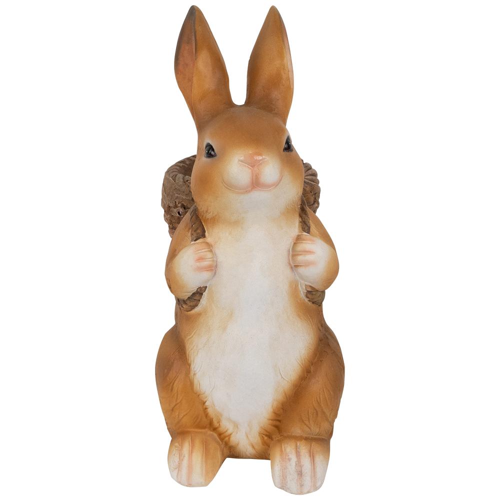 Standing Bunny Carrying a Basket Outdoor Garden Statue - 16.75". Picture 1