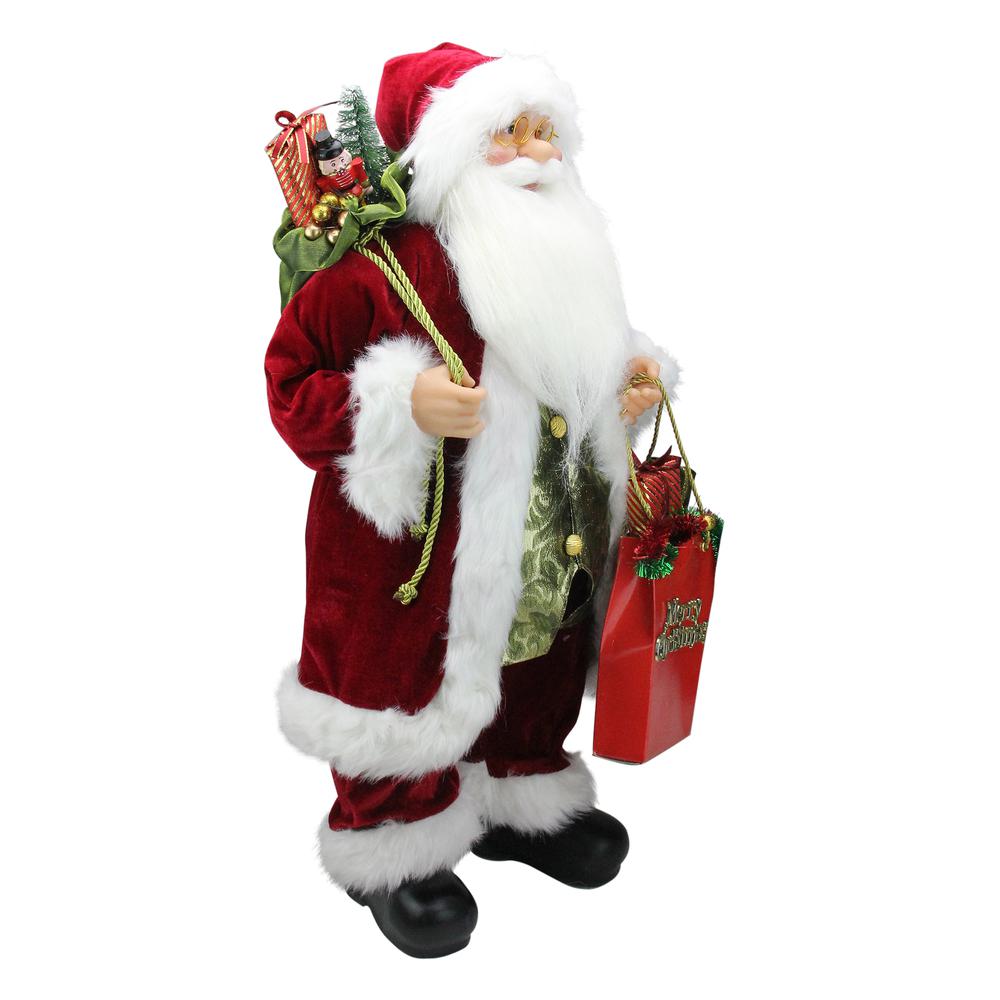 24" Poinsettia Santa Claus with Gift Bag Christmas Figure. Picture 2