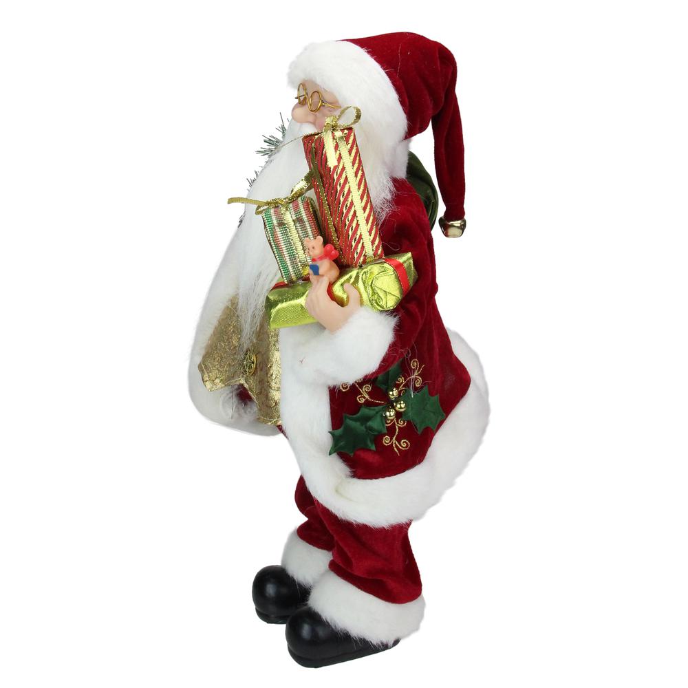 16" Red and White Traditional Holly Berry Standing Santa Claus Christmas Figure with Gift Bag. Picture 3