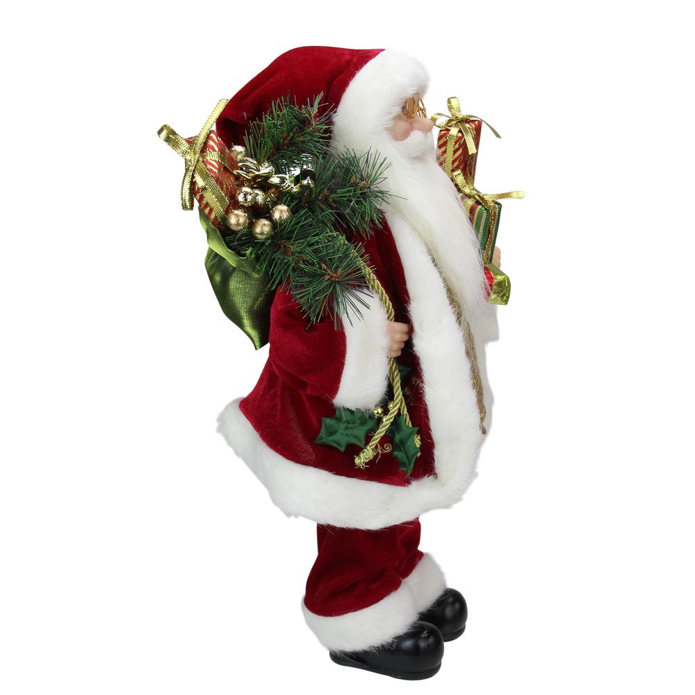 16" Red and White Traditional Holly Berry Standing Santa Claus Christmas Figure with Gift Bag. Picture 4