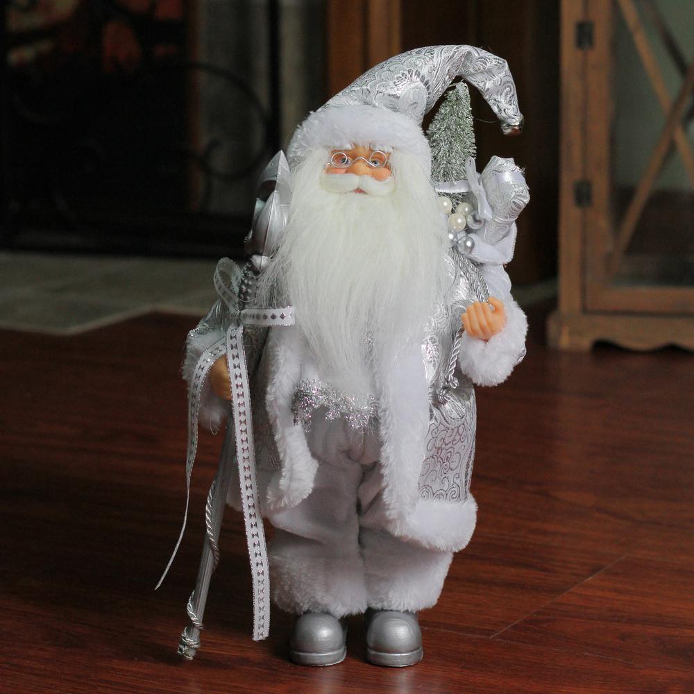 12" White and Silver Santa Claus with Staff and Gift Bag Christmas Figure. Picture 3