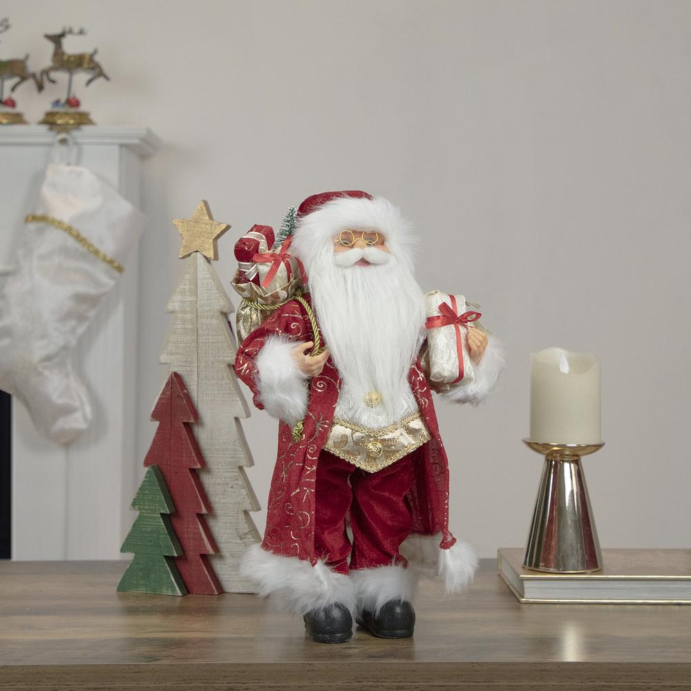 16" Red and Gold Filigree Santa Claus with Gifts Christmas Figurine. Picture 2