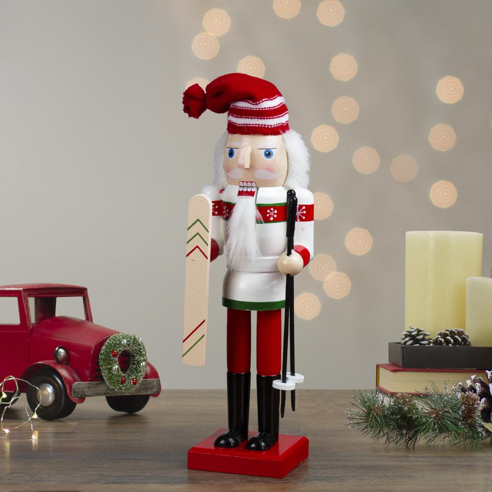 14" Red and White Wooden Skiing Christmas Nutcracker. Picture 2