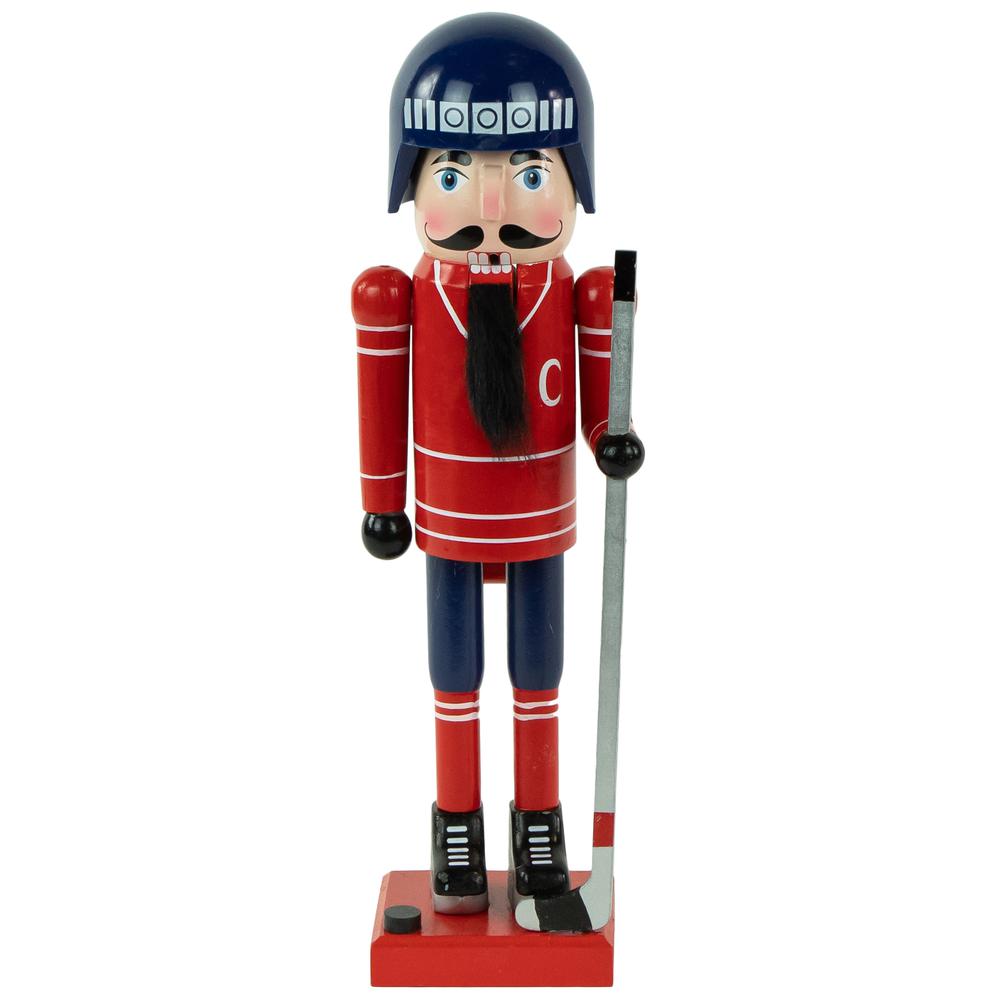 14" Blue and Red Wooden Christmas Ice Hockey Player Nutcracker. Picture 1