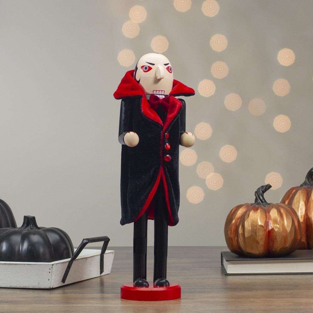 14" Black and Red Wooden Vampire Halloween Nutcracker. Picture 2