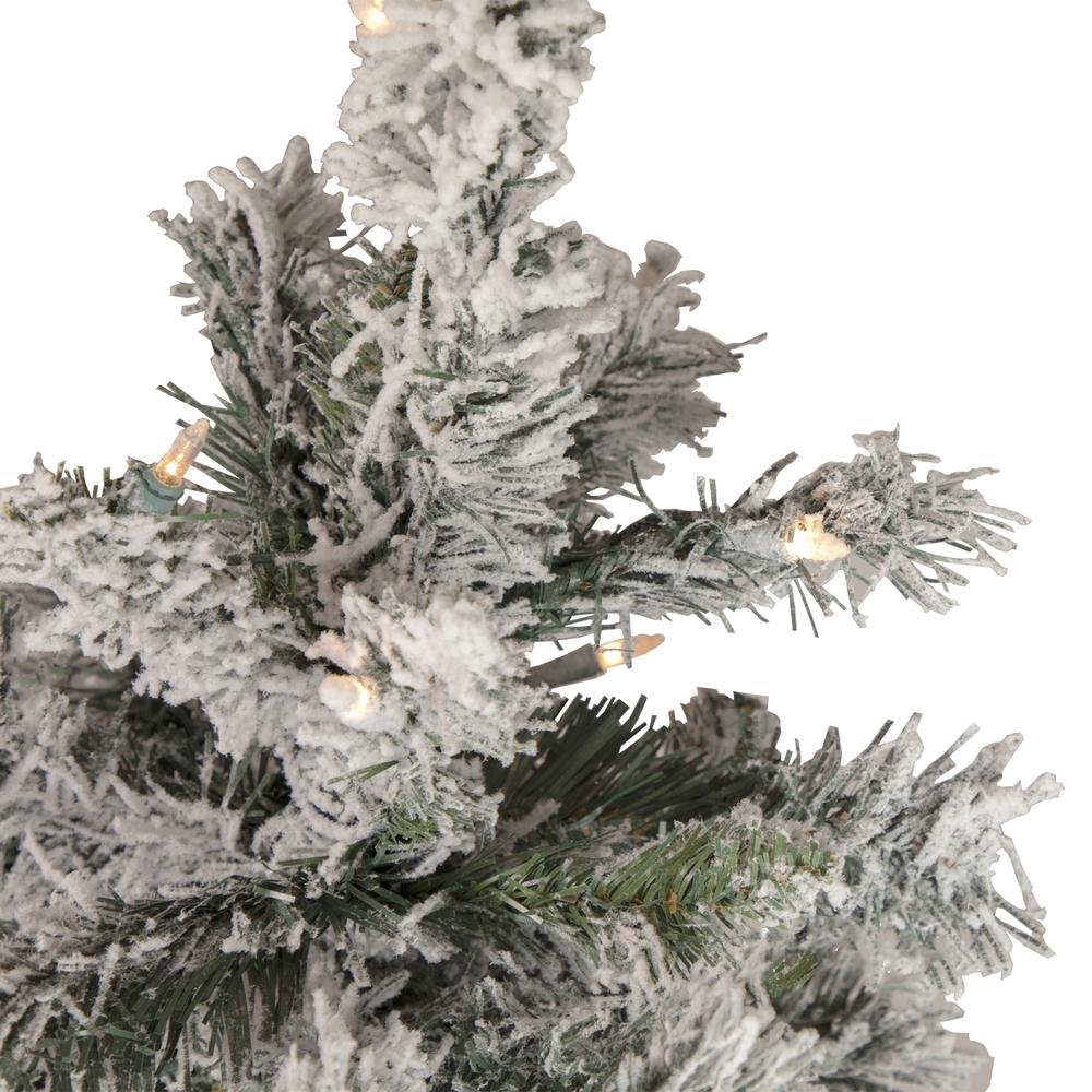 4.5' Pre-Lit Flocked Pine Medium Artificial Christmas Tree - Clear Lights. Picture 4