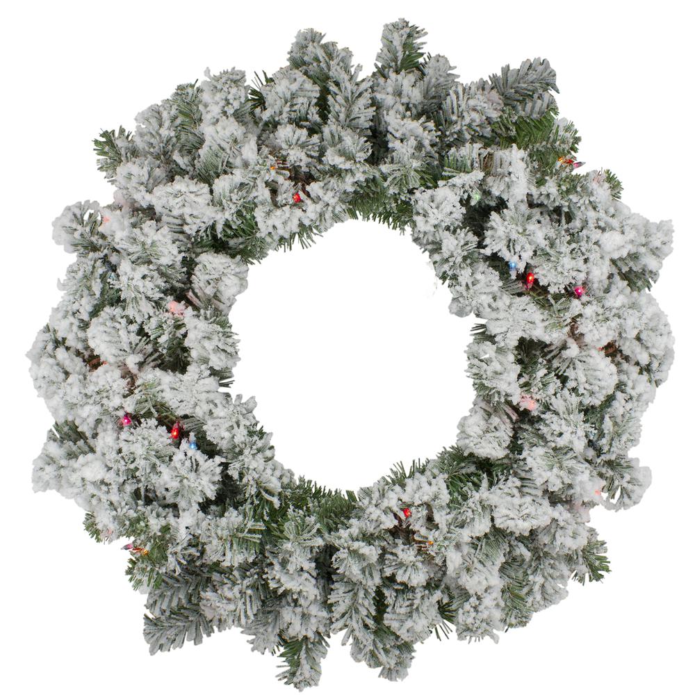 Pre-Lit Heavily Flocked Pine Artificial Christmas Wreath - 24-Inch  Multi-Color Lights. Picture 1