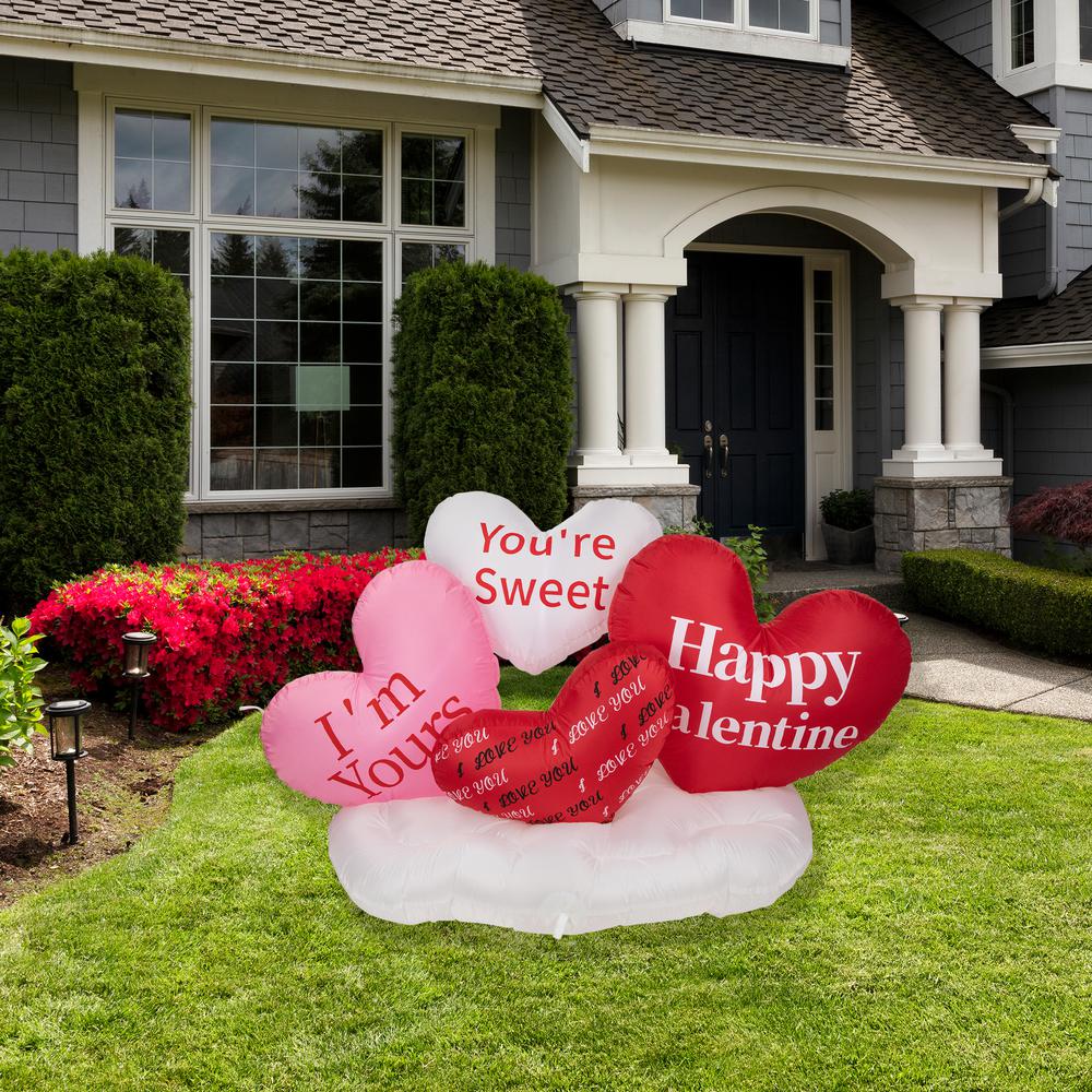 5' Inflatable Lighted Valentine's Day Conversation Hearts Outdoor Decoration. Picture 1