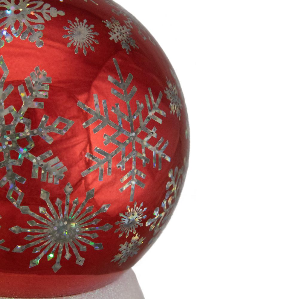 6.5" LED Lighted Shiny Red Snowflake Water Globe Tabletop Decoration. Picture 3