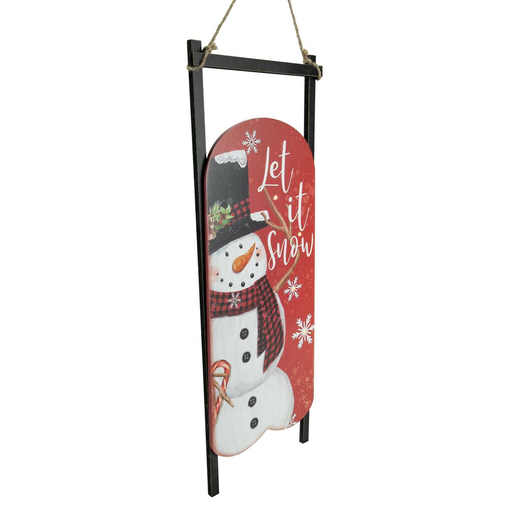 21.75" LED Lighted 'Let it Snow' Snowman Sled Christmas Wall Sign. Picture 3