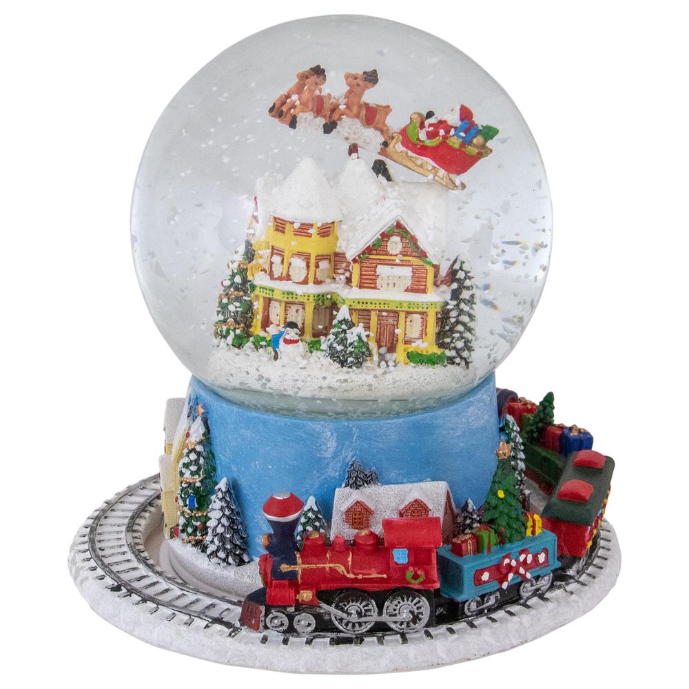 6.5" Revolving House with Santa and Train Musical Christmas Snow Globe. Picture 1