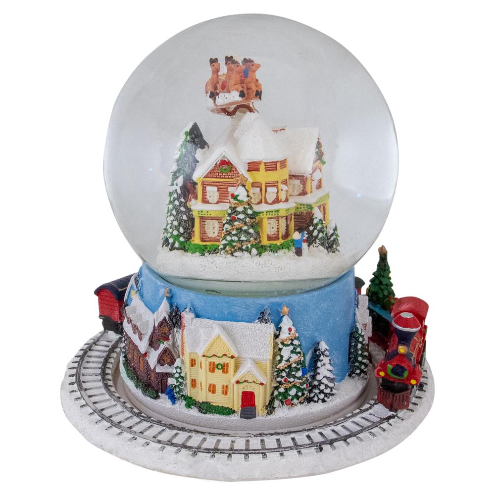 6.5" Revolving House with Santa and Train Musical Christmas Snow Globe. Picture 5