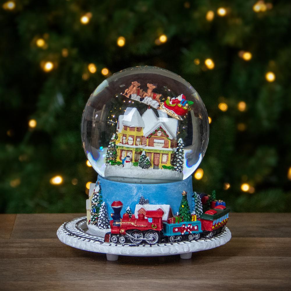 6.5" Revolving House with Santa and Train Musical Christmas Snow Globe. Picture 2