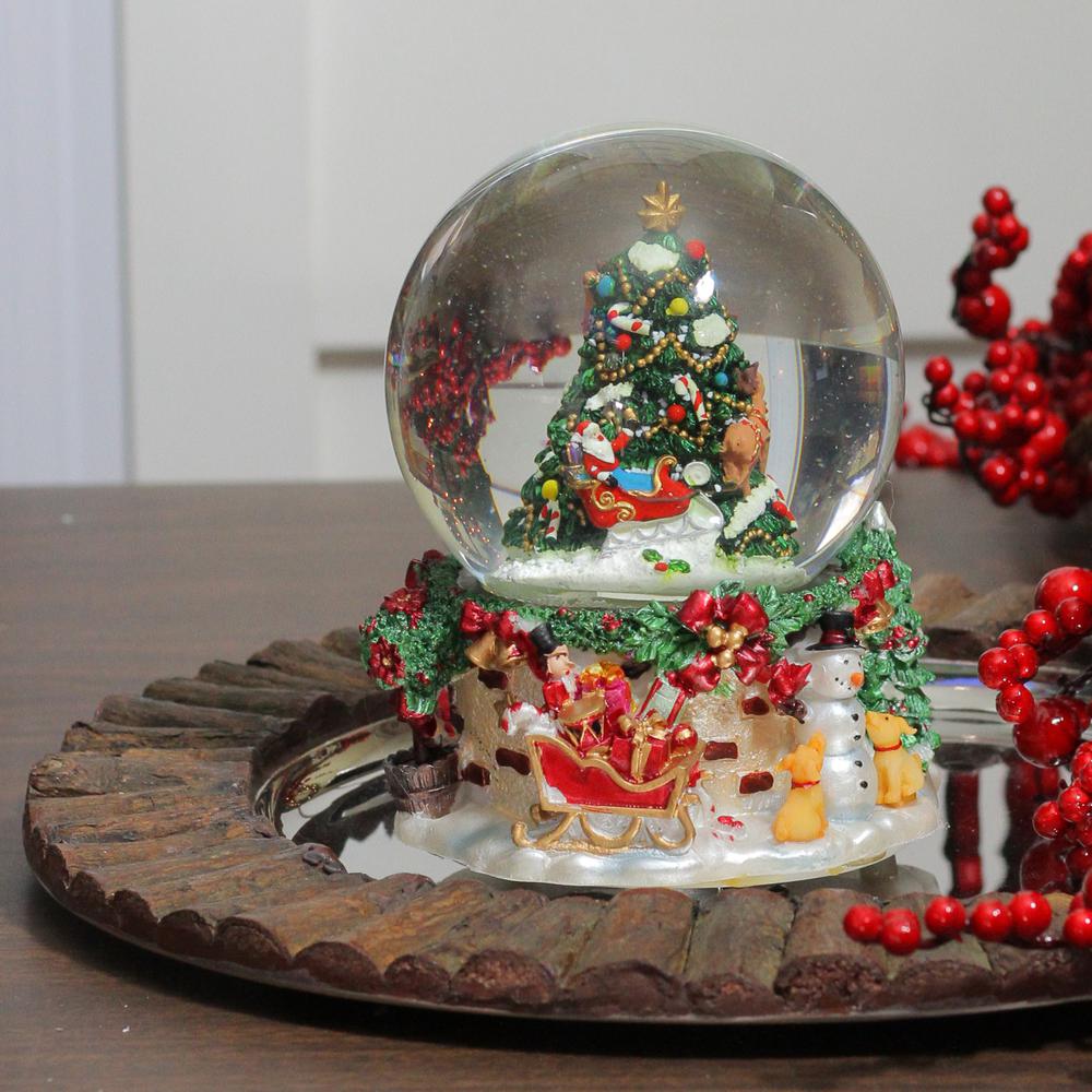 6.75" Christmas Tree and Santa Claus Musical Snow Globe. Picture 3
