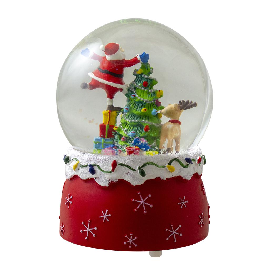 5.75" Santa Decorating a Christmas Tree Musical Snow Globe. Picture 3