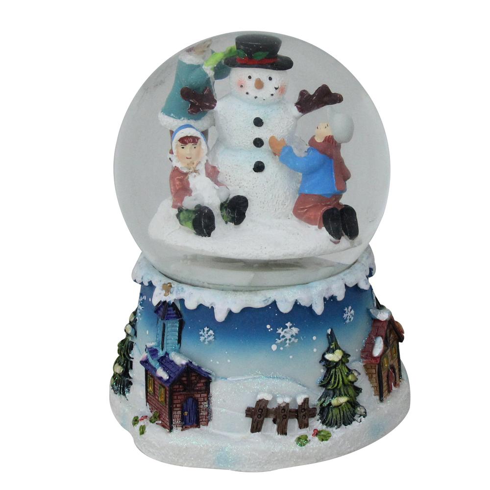 5.75" Children Building Snowman Musical Christmas Snow Globe. Picture 1
