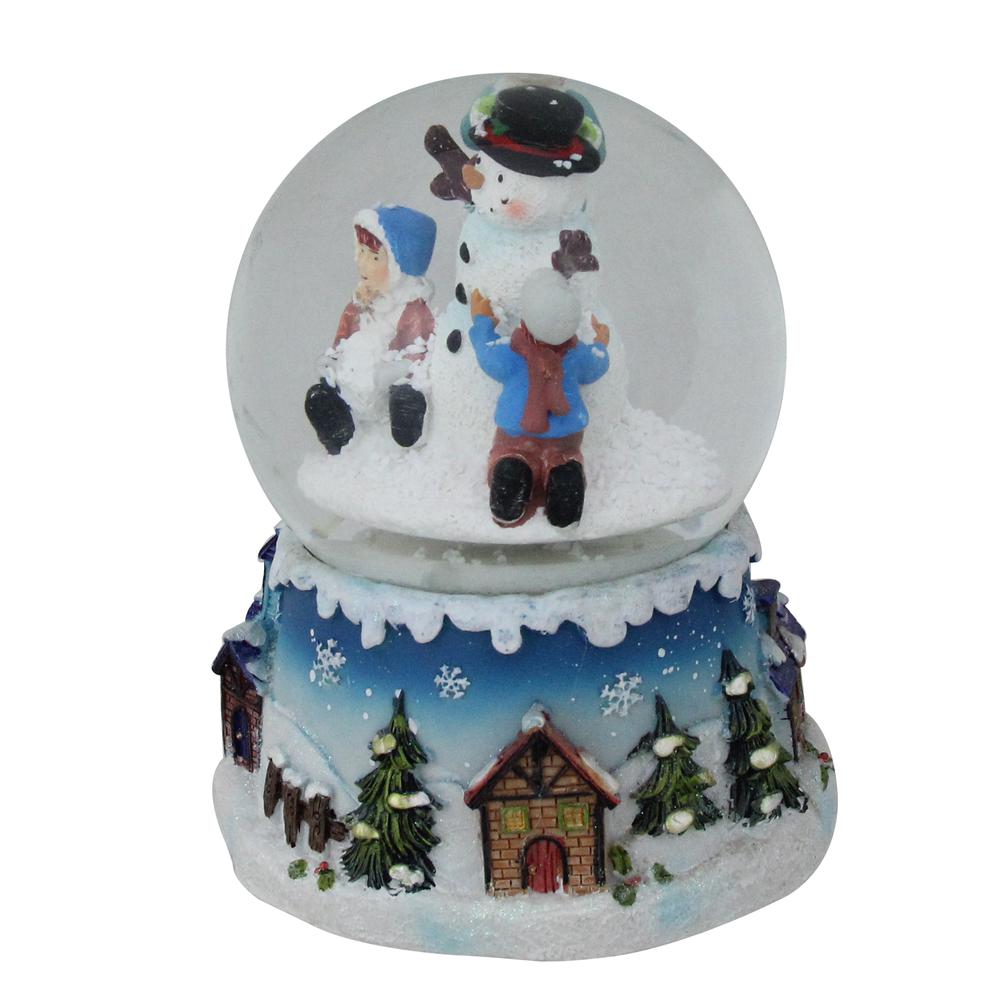 5.75" Children Building Snowman Musical Christmas Snow Globe. Picture 2