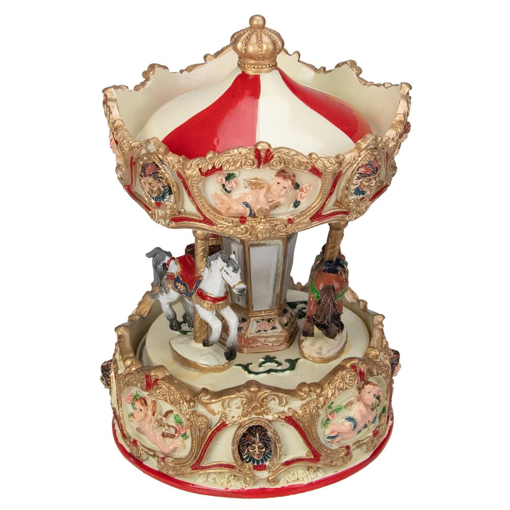 6.5 Ivory and Gold Animated Musical Clown and Cupid Carousel Tabletop Decoration. The main picture.