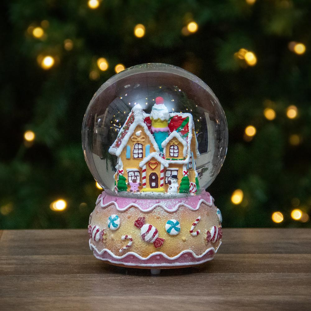 6.5" Gingerbread House Musical Christmas Snow Globe. Picture 2