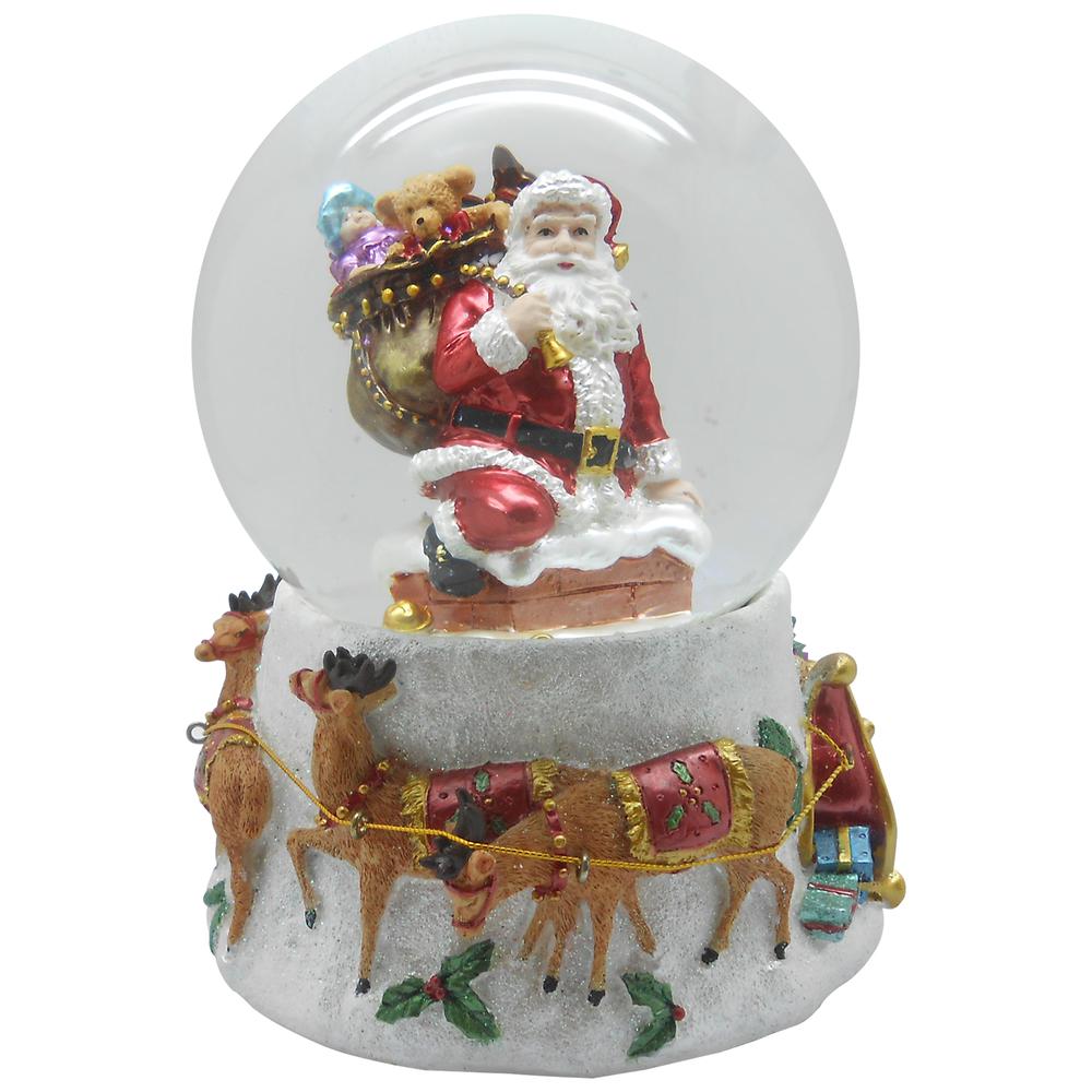 6.75" Santa Going Down the Chimney Musical Christmas Snow Globe. Picture 1