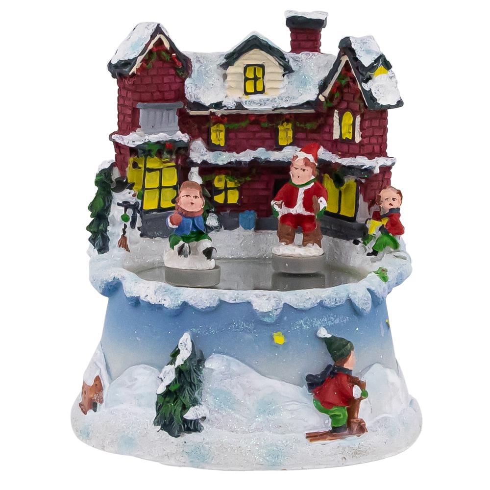 5.25" Animated and Musical Village Ice Skating Pond Christmas Scene. Picture 1
