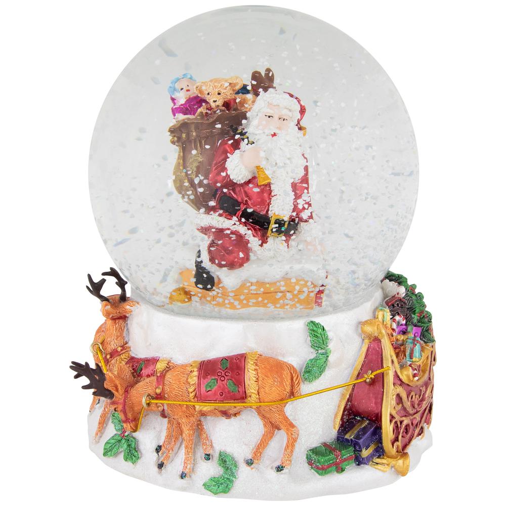 6.5" Santa Delivering Gifts Musical Christmas Snow Globe. Picture 1
