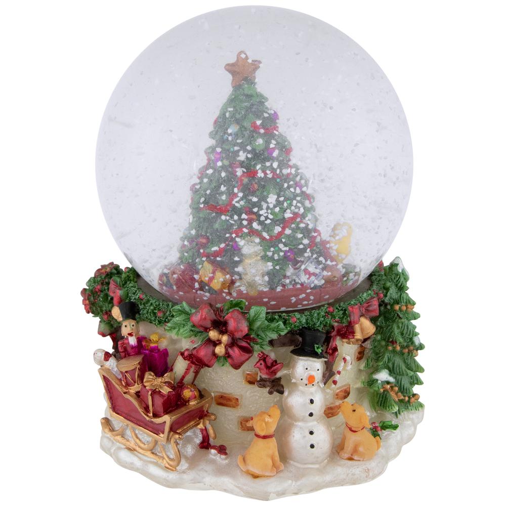 6.5" Gifts Under the Christmas Tree Musical Snow Globe. Picture 1