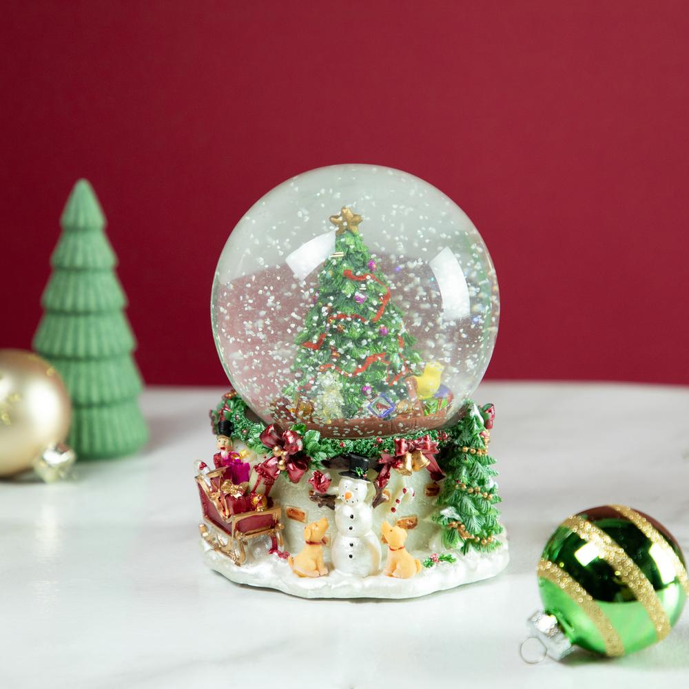 6.5" Gifts Under the Christmas Tree Musical Snow Globe. Picture 2