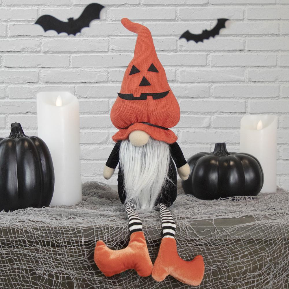 22" Halloween Jack-O-Lantern Striped Tabletop Gnome Figurine with Dangling Legs. Picture 1