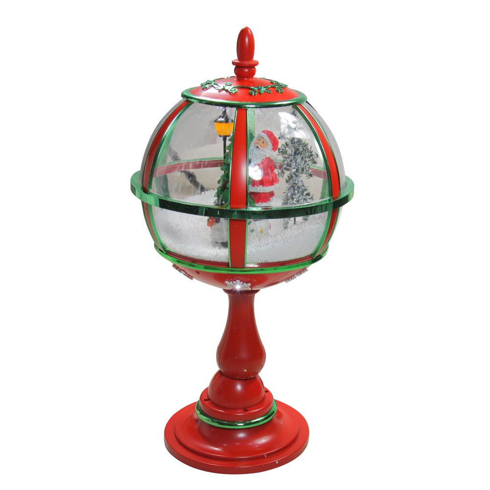 23.5" Lighted Red Musical Snowing Santa with Christmas Tree Street Lamp. Picture 2