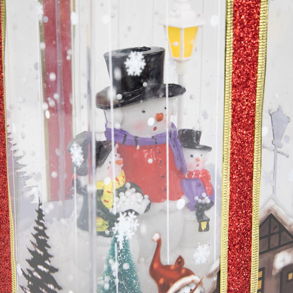 12" Lighted and Musical Snowman Family Snowing Gift Box Christmas Decoration. Picture 4