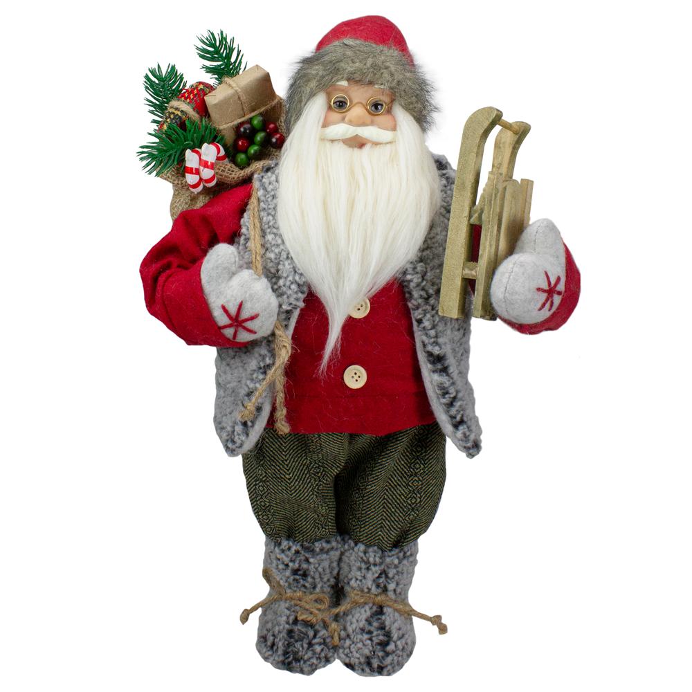 18" Standing Santa Christmas Figure Carrying Presents and a Sled. Picture 1