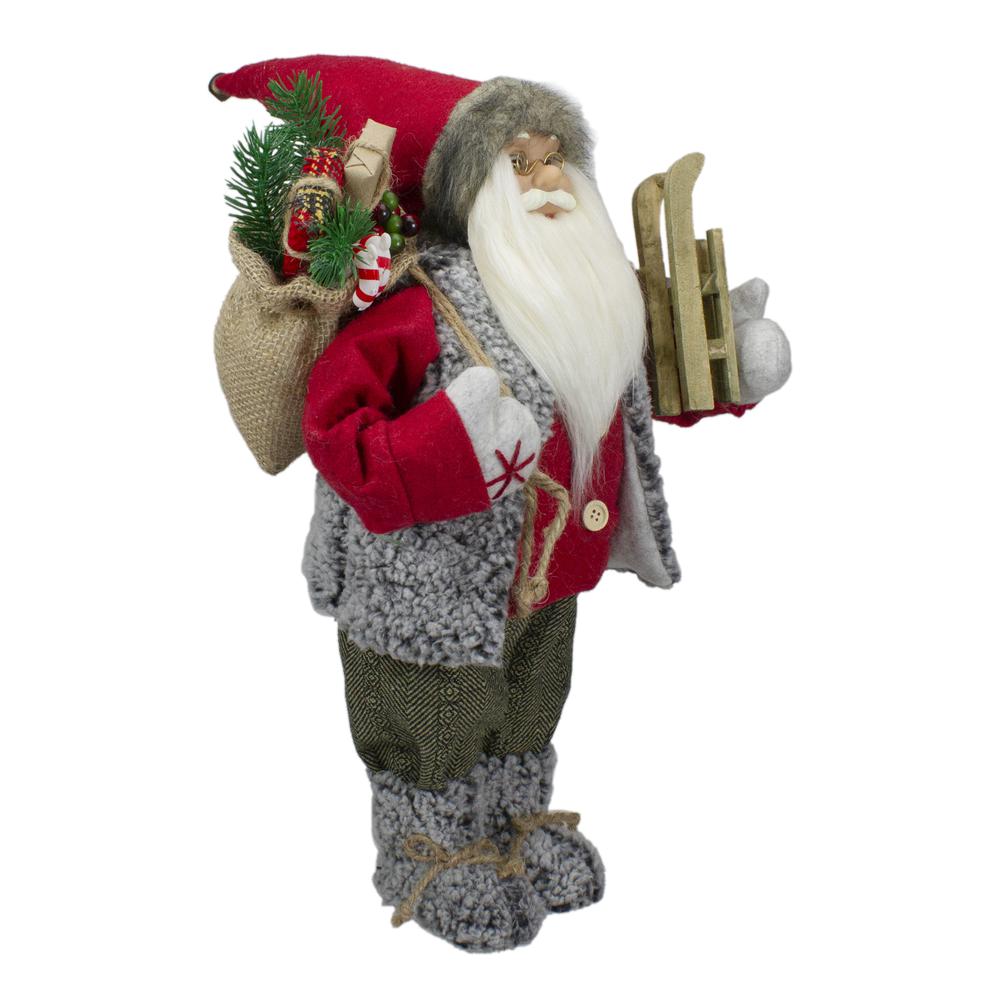 18" Standing Santa Christmas Figure Carrying Presents and a Sled. Picture 3