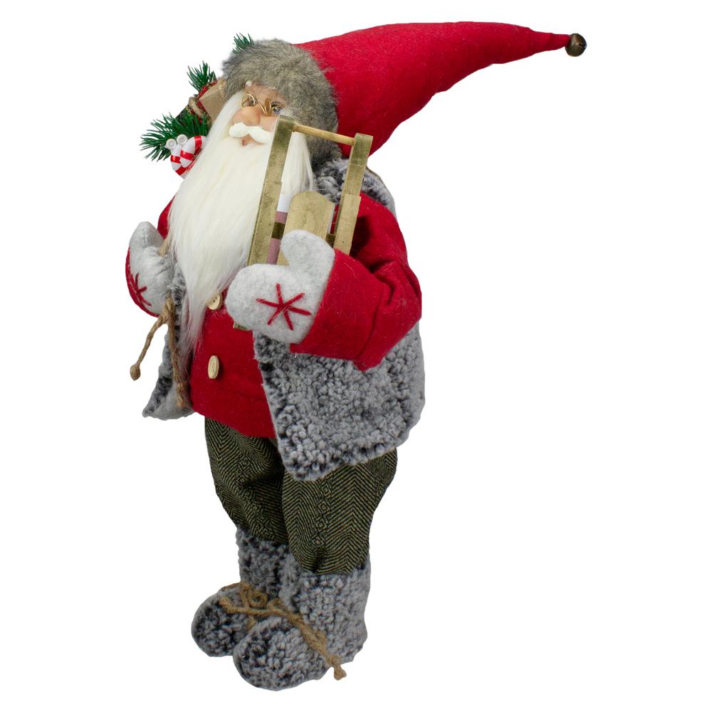 18" Standing Santa Christmas Figure Carrying Presents and a Sled. Picture 4