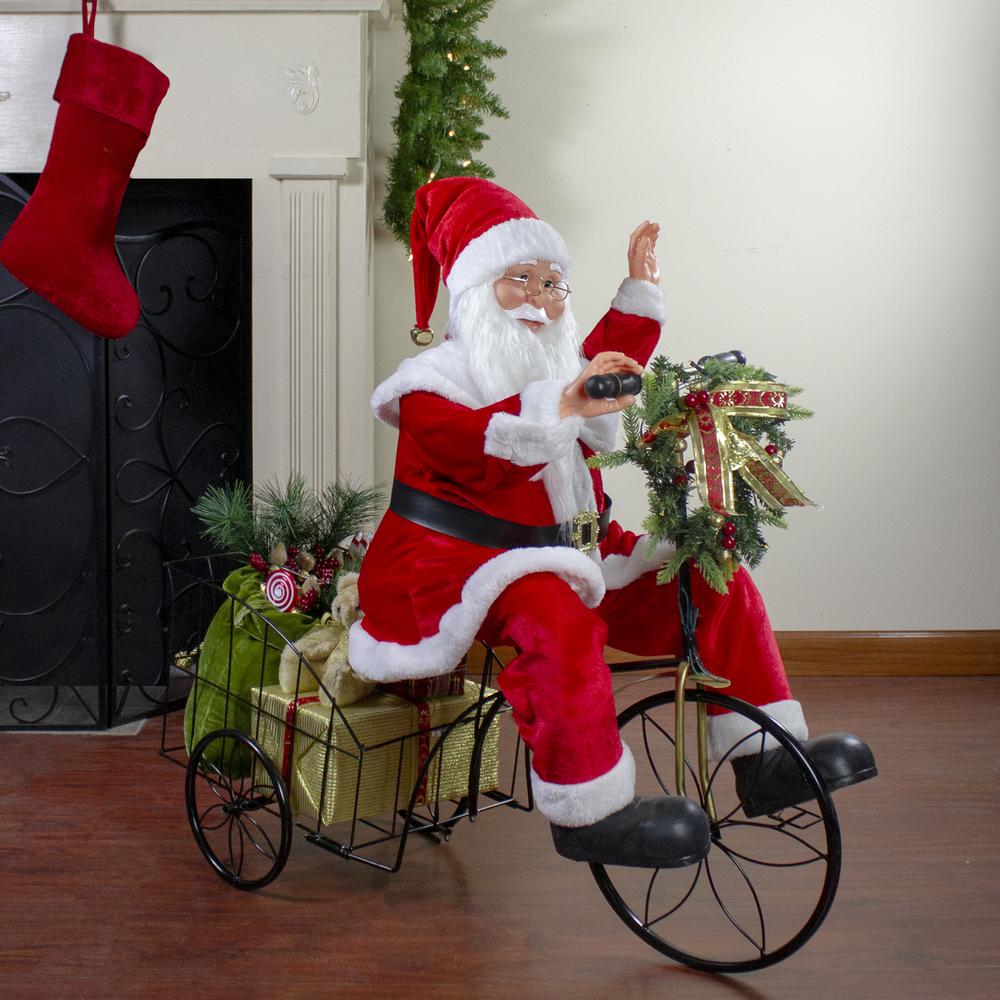 32" Pre-Lit LED Animated and Musical Santa Claus Riding a Tricycle Christmas Figurine. Picture 2