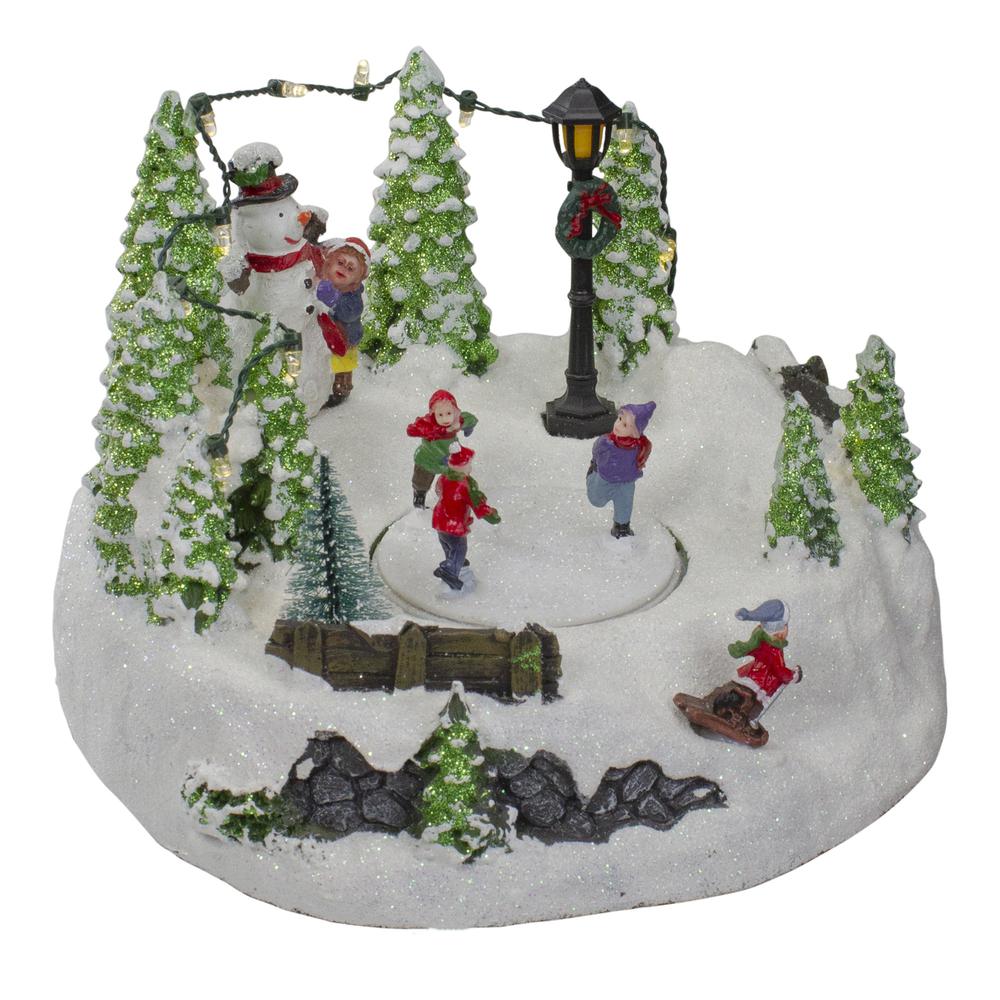 9" Lighted Christmas Scene with Moving Skaters and a Snowman. Picture 3