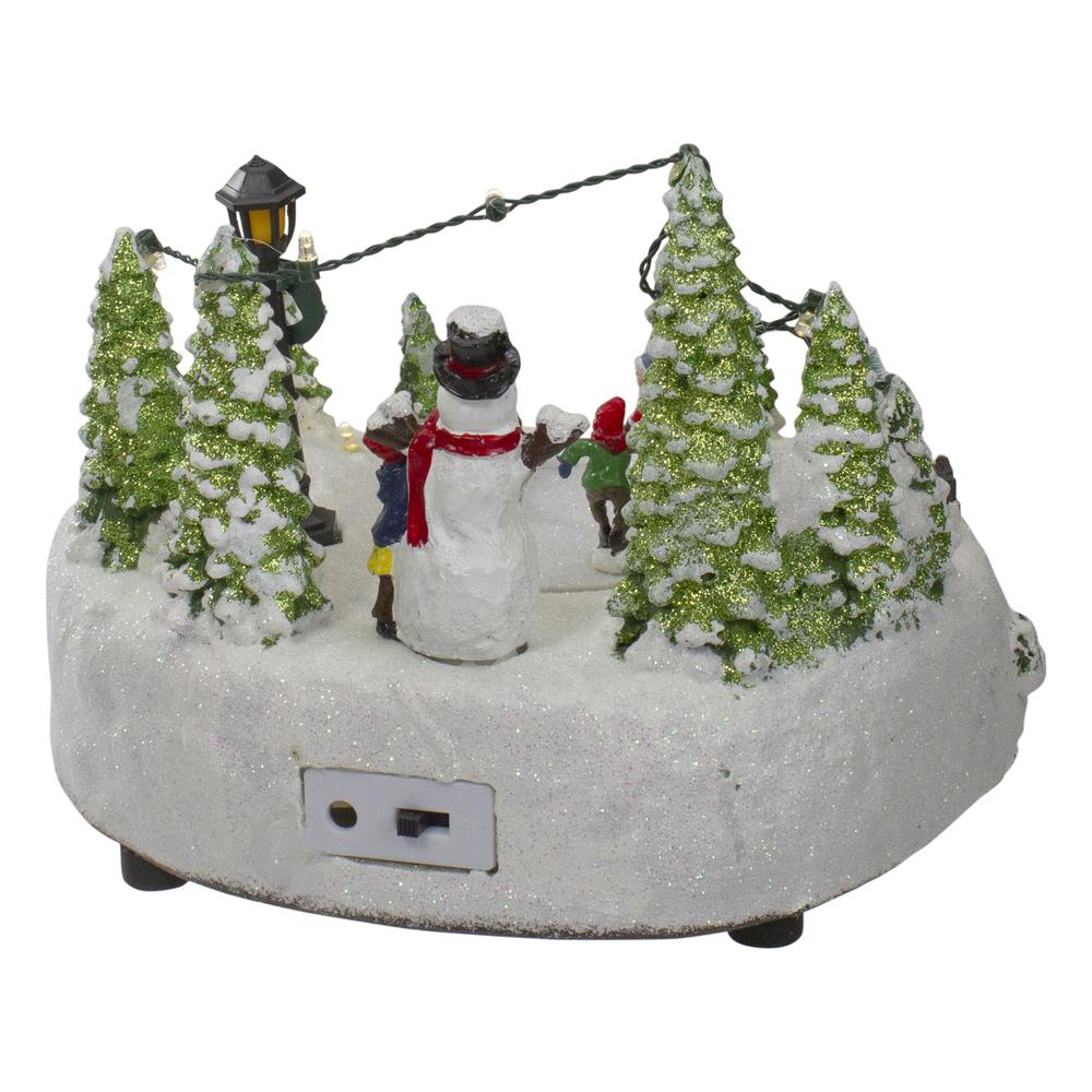 9" Lighted Christmas Scene with Moving Skaters and a Snowman. Picture 5