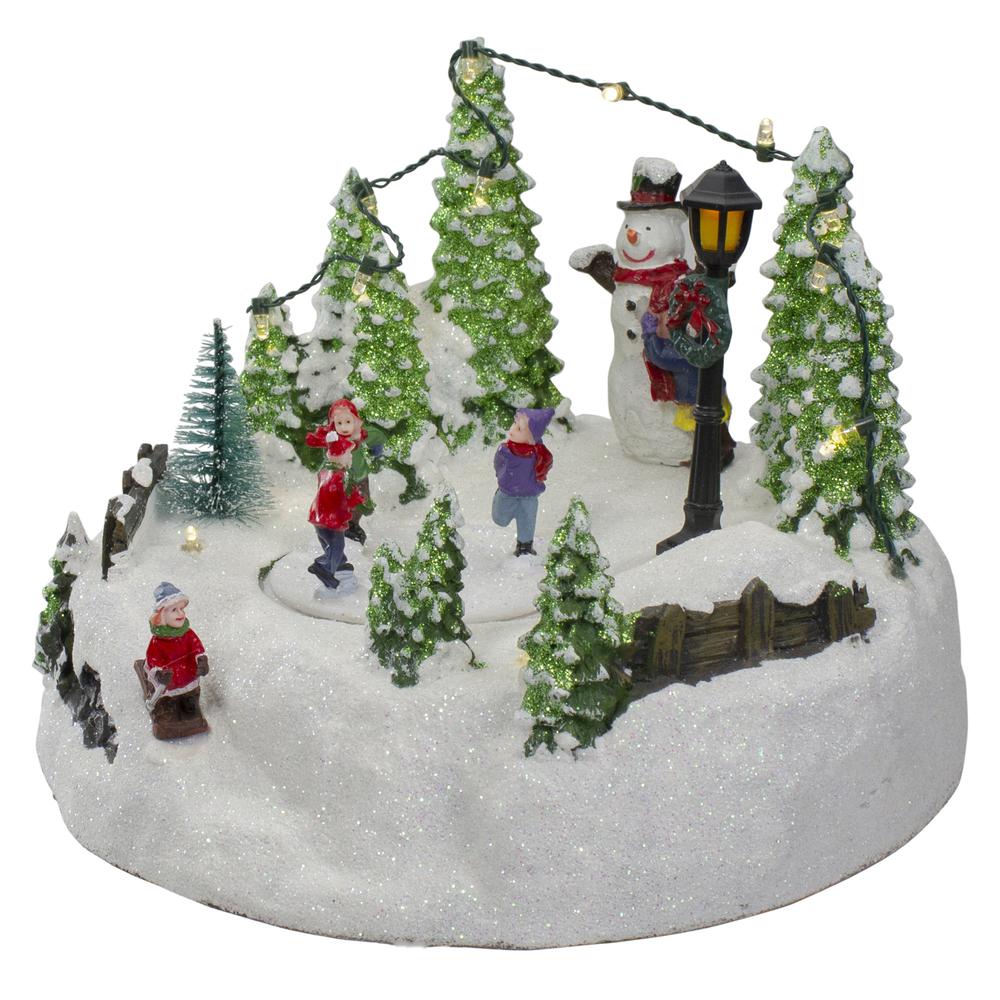 9" Lighted Christmas Scene with Moving Skaters and a Snowman. Picture 4