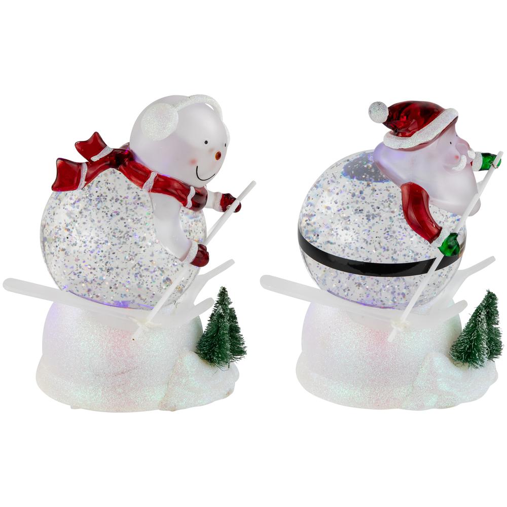 Set of 2 Lighted Skiing Santa and Snowman Glittered Christmas Snow Globes 7". Picture 1