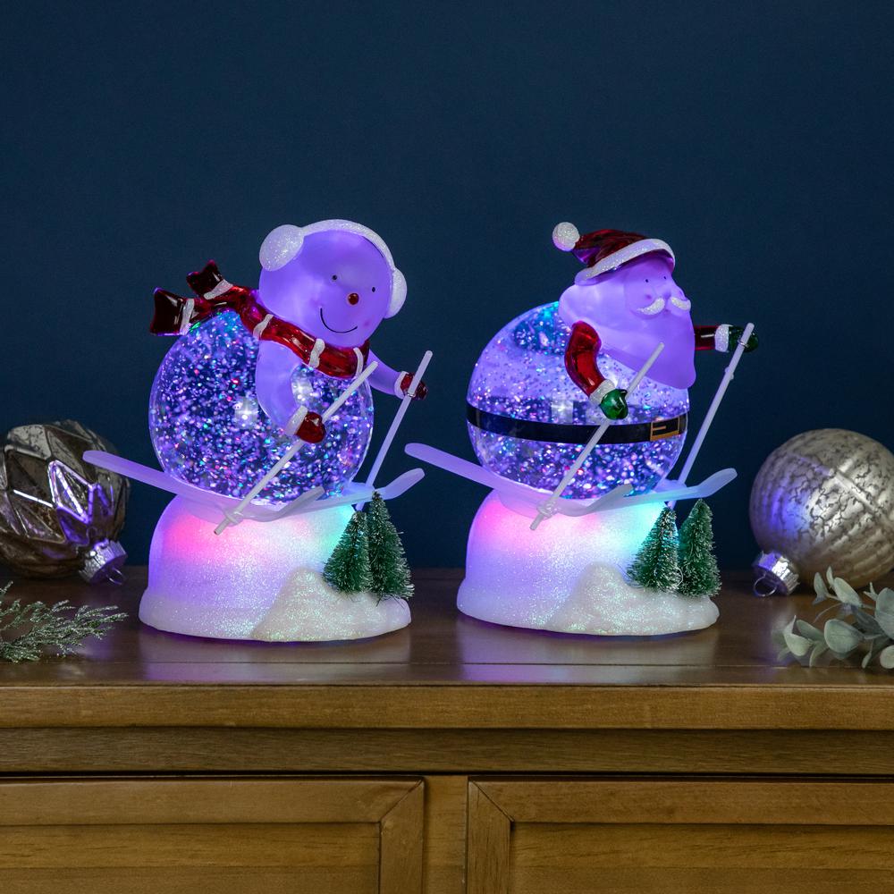 Set of 2 Lighted Skiing Santa and Snowman Glittered Christmas Snow Globes 7". Picture 2