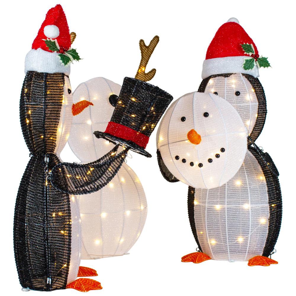 Set of 3 LED Lighted Penguins Building Snowman Outdoor Christmas Decoration 35". Picture 2