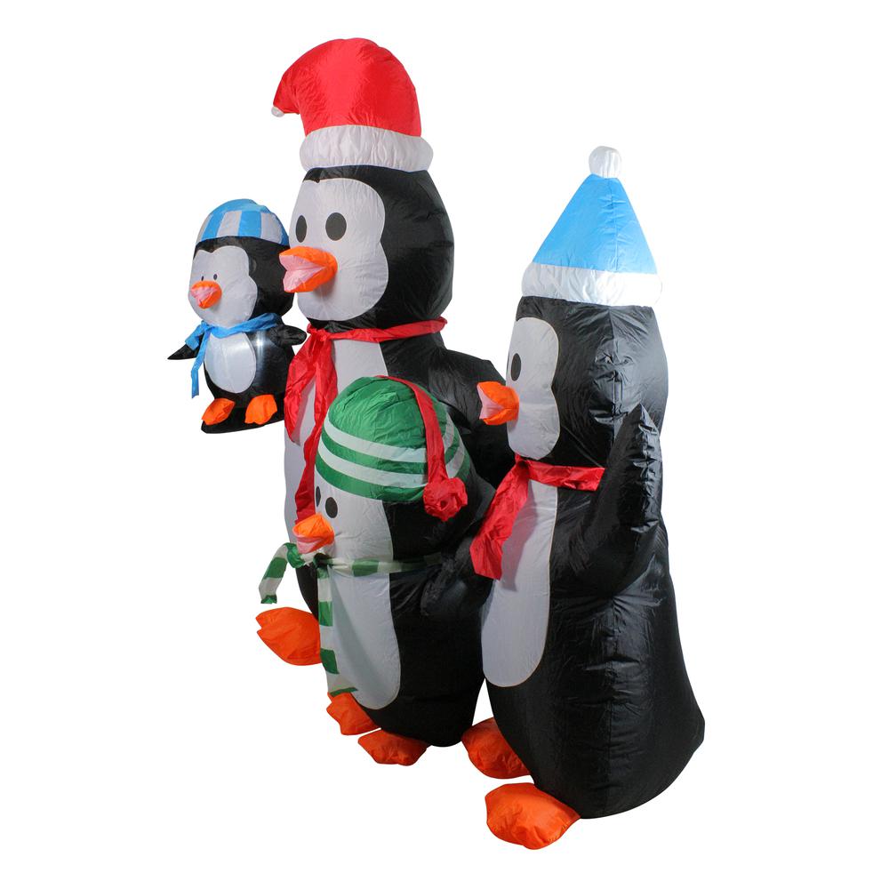 5' Lighted Black and Orange Inflatable Penguin Family Christmas Yard Art Decor. Picture 2