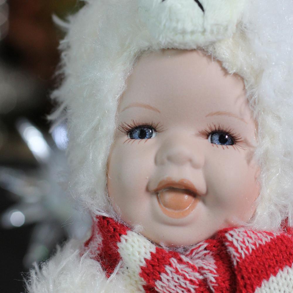 5.75" White and Red Baby in Polar Bear Costume with Santa Hat Collectible Christmas Doll. Picture 3