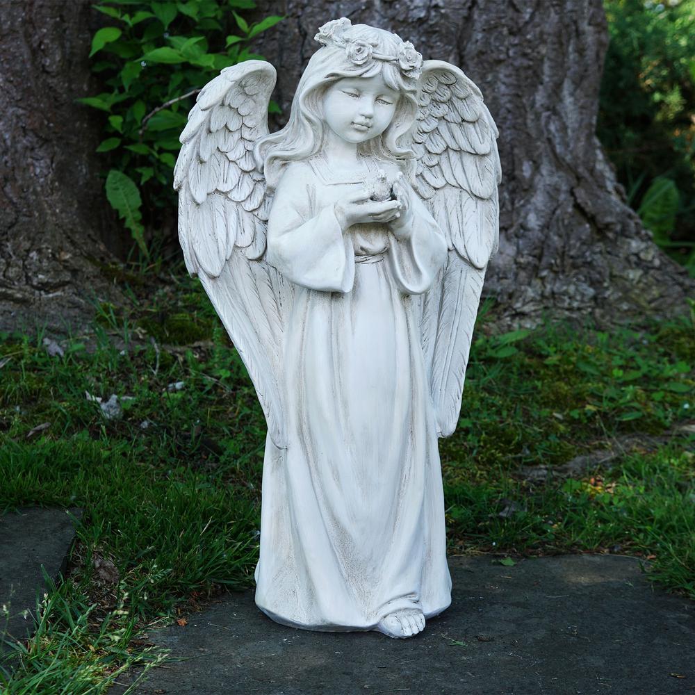 20.5" White Standing Angel Holding a Bird Outdoor Garden Statue. Picture 2