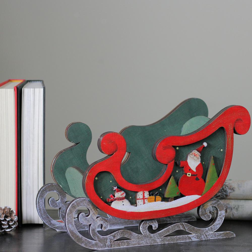 8" Red and Green Sleigh with Santa Claus and Snowman Christmas Decoration. Picture 3