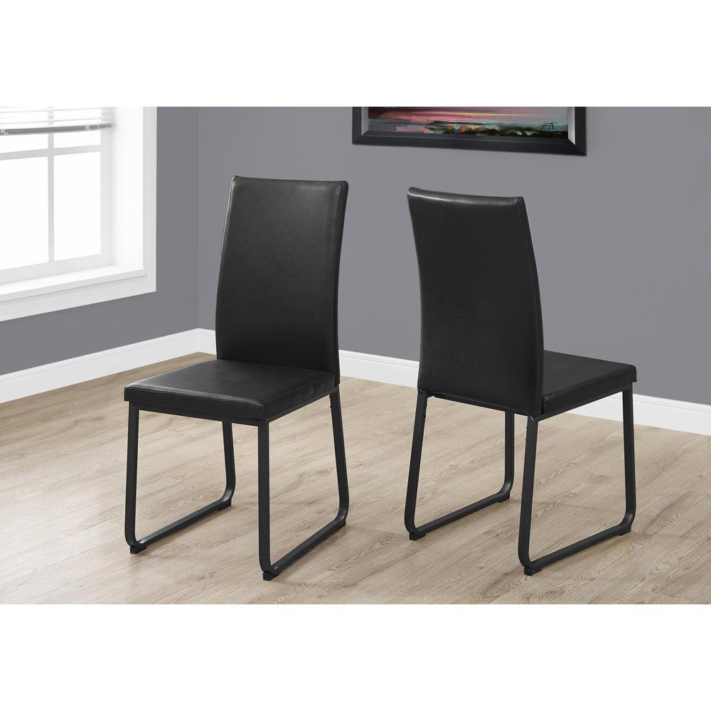 Two 38" Black Faux Leather and Metal Dining Chairs - 332616. Picture 1