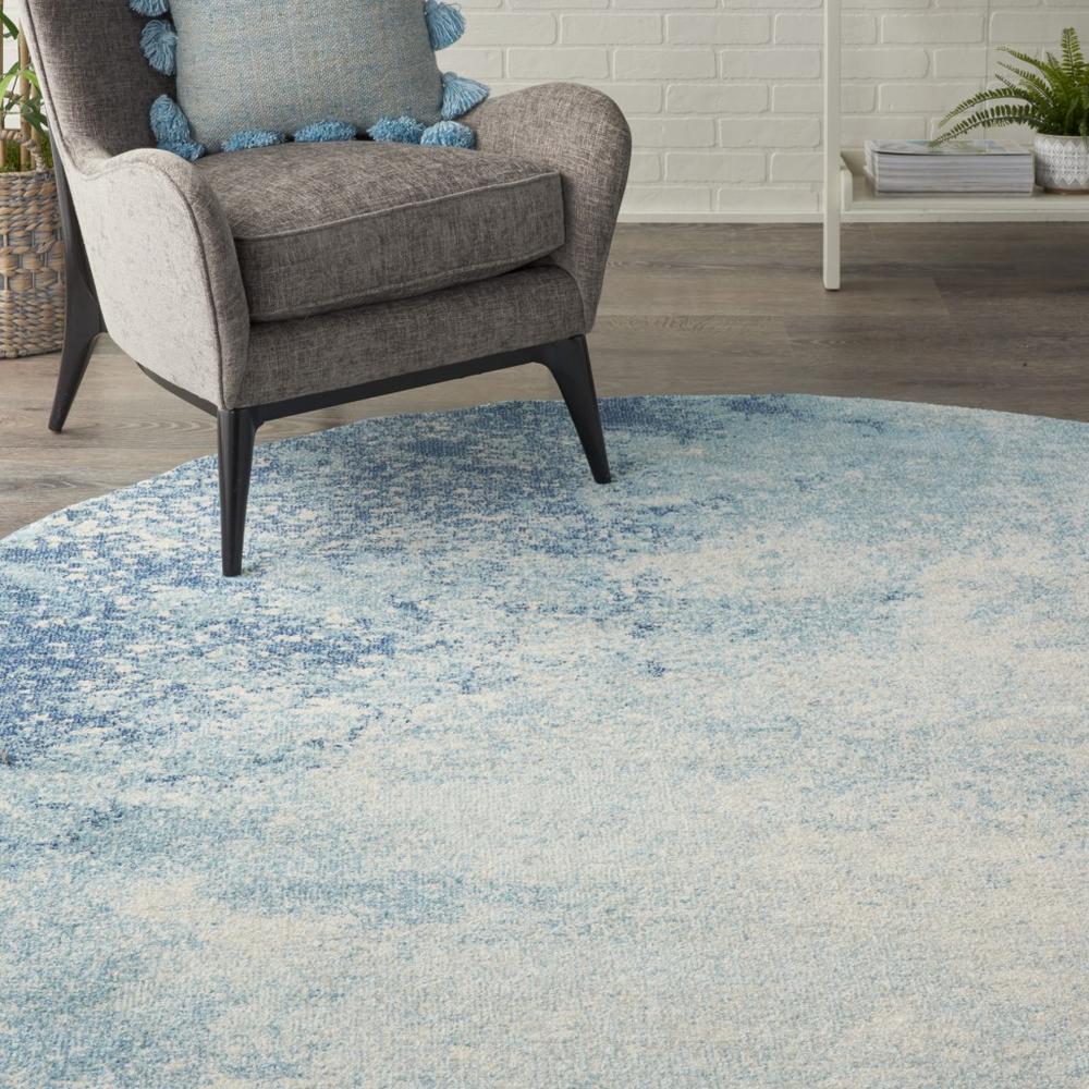 8’ Round Light Blue and Ivory Abstract Sky Area Rug Navy/Light Blue. Picture 5