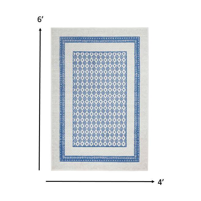 4’ x 6’ Ivory and Blue Geometric Area Rug Ivory Blue. Picture 1